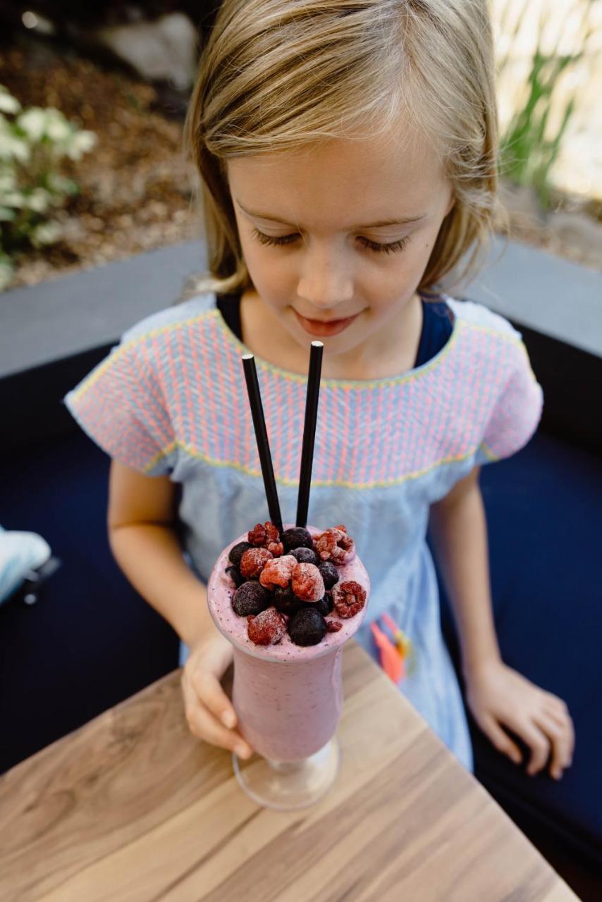 Rumba Beach Resort Caloundra Exterior photo A girl with a smoothie